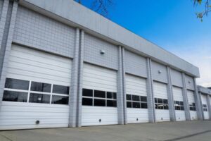 overhead doors with windows on a commercial building