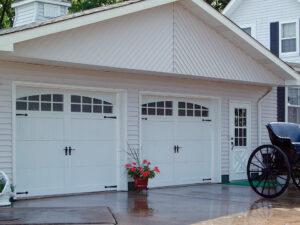two garage doors installed on a large garage on a family home