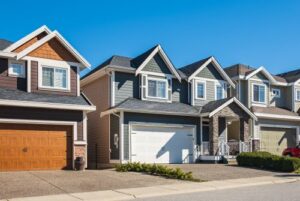 houses in a neighborhood with new garage doors