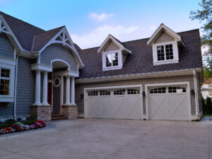a large family home with two new garage doors